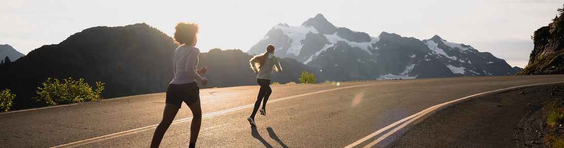 Two people running on road wearing Superfeet insoles and shoe inserts