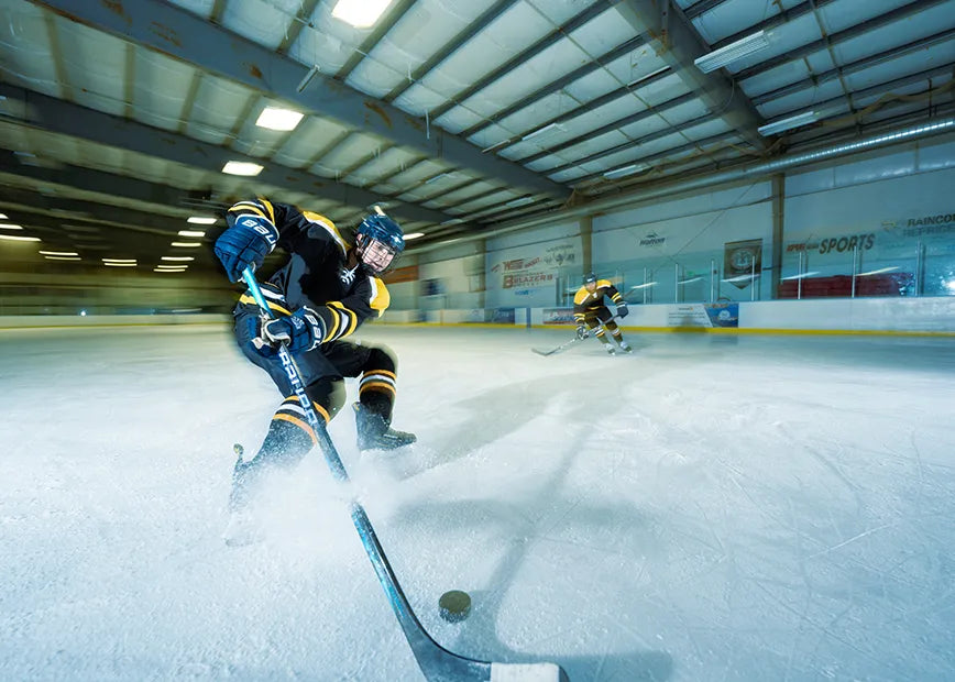 Woman playing hockey while wearing Superfeet insoles.