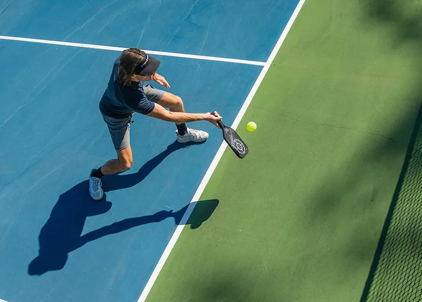 Man playing pickleball while wearing All-Purpose Support High Arch Superfeet insoles.